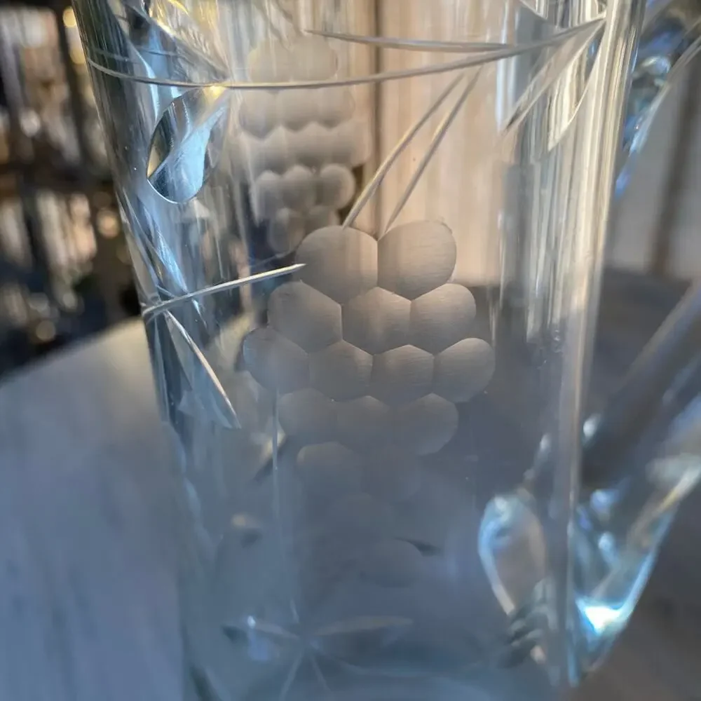 Vintage wine pitcher with etched grapes